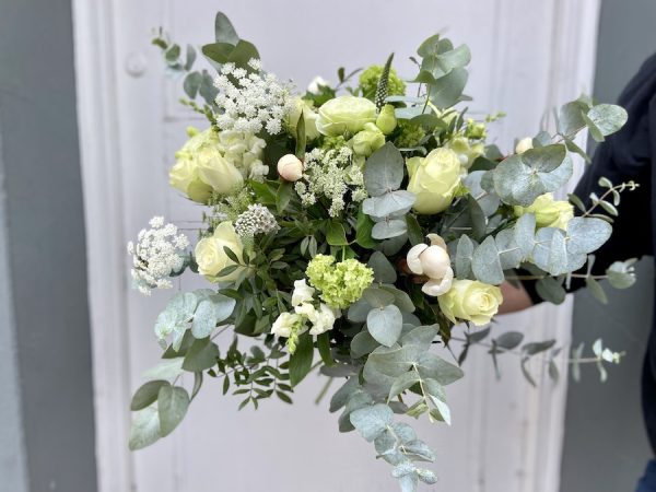 Austen is a wild white and green bouquet created in a natural style. The image has lots of eucalyptus and foliages.