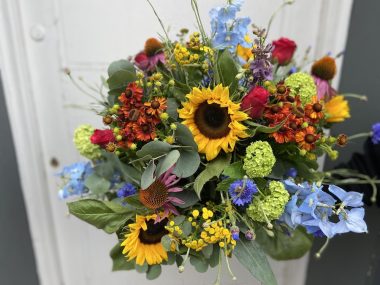 Jude is a colourful bouquet made of wild looking flowers.