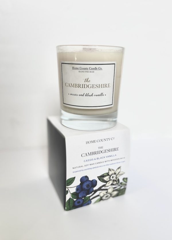 Cambridgeshire candle sat on top of card box.
