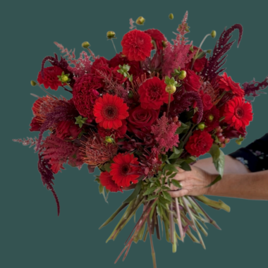 Ruby is a red and hot pink bouquet of flowers that is whimsical and romantic. The perfect gift for an anniversary or for your love.